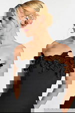 Close-up of beaded flower embellishments on strapless neckline