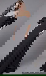 Jovani 45653 black off-the-shoulder mermaid evening gown with sweetheart neckline, dramatic oversized ruffle puff sleeves, and floor-length fitted silhouette.