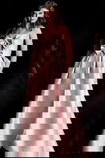 Glamorous strapless formal gown with oversized bow accents and voluminous silhouette