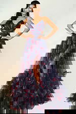 Elegant ruffled gown with floral tulle and high slit design