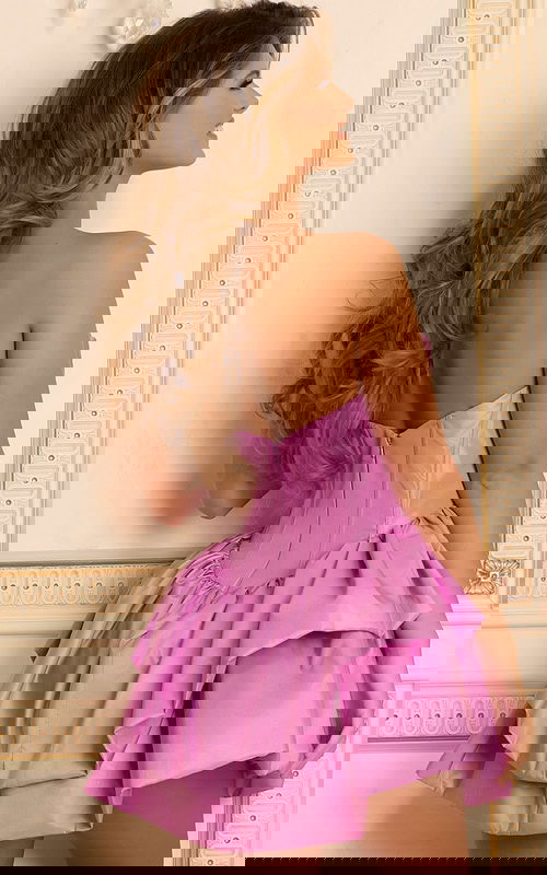 Lilac mini dress with sculpted bodice and ruffled hem