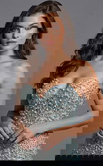 embellished strapless evening gown with intricate beadwork and floor length skirt