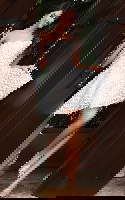 Strapless light pink beaded mini dress with flared skirt