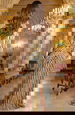 Back view of fully beaded gown with sheer illusion detailing