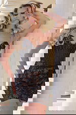 Black mini dress with sheer corset top and floral lace embroidered skirt