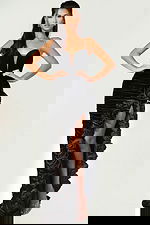 Velvet gown with ruched fabric and ruffled slit detail