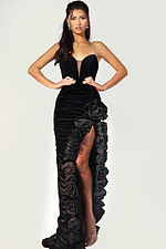Velvet gown with ruched fabric and ruffled slit detail