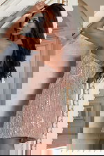 Back view of fitted sequin dress with light gold shimmer detail