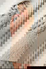 Back view of fitted pearl-beaded dress with scoop back and nude mesh