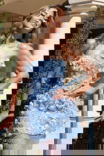 Light blue floral gown with layered bodice and transparent lower skirt