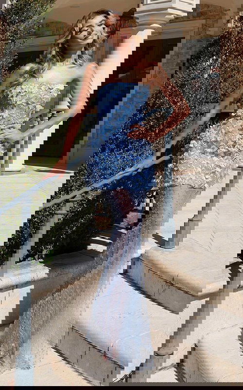 Blue embroidered formal dress with sheer dotted mesh and floral accents