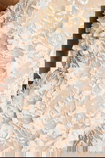 Ivory formal gown with leaf embroidery and dimensional flowers