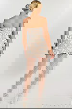 Detailed view of layered floral appliqués on ivory mesh dress