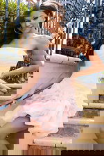 Strapless ruched mini dress with rosette skirt