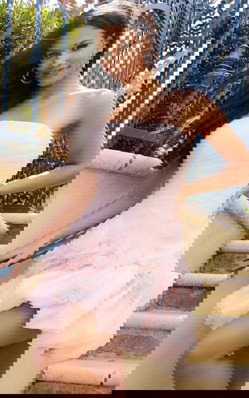 Strapless ruched mini dress with rosette skirt