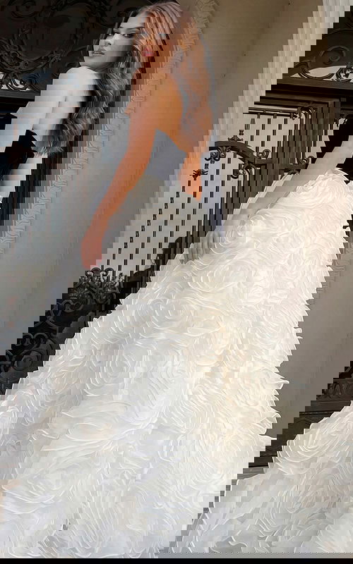 Elegant strapless gown featuring contrast bodice and statement floral skirt