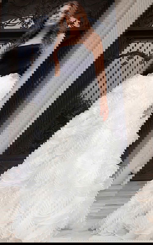 Full length strapless gown with dramatic white rosette skirt and structured bodice