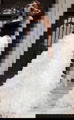 Full length strapless gown with dramatic white rosette skirt and structured bodice