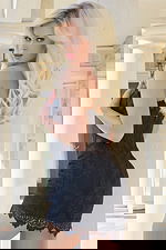 Black corset-style mini dress featuring lace overlay