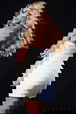 Back view of strapless mini dress featuring sculpted fit and statement floral applique