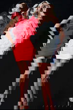 Models wearing elegant mini dresses, one in red with dramatic ruffles and the other in white featuring a large organza flower design