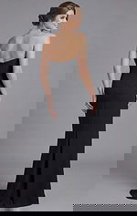 Back view of strapless black fitted evening gown with center zipper and sleek silhouette