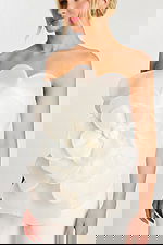 Detailed bodice view showing large flower on jumpsuit