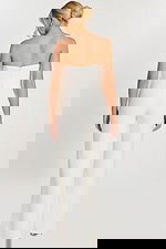 Back view of strapless off-white jumpsuit with zipper closure