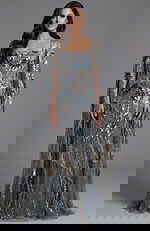 Sequin embellished gown with square neckline and cape sleeves