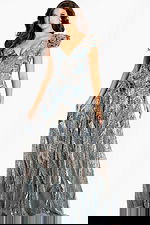 V-back glitter gown with sequin leaf patterns and soft ruffle shoulders