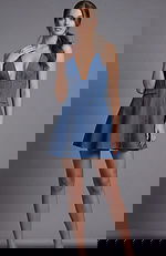 Front view of a halter mini dress with deep V neckline and fitted waist