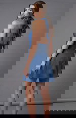 Back view of a halter mini dress with open back and flared skirt