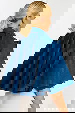 Back Angle View of Flared Denim Cape Jacket with Flowing Silhouette and Shoulder Seams