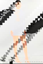 Black open back dress with crystal floral embellishments