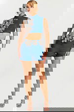 Front view of denim two-piece set with crystal floral appliqué