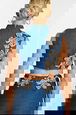 Back zipper view of sleeveless crop top with crystal flowers