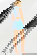 Rear angled view of floral embellished denim shorts set