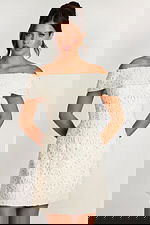 Front view of off-white lace dress with structured bodice and short hemline