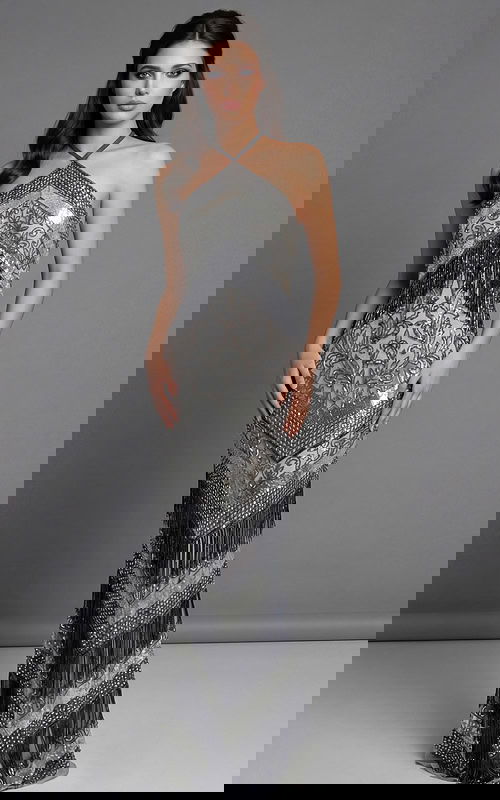 Front view of a fitted halter gown with geometric beading and fringe detailing