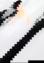 Elegant gown with intricate beadwork and soft flutter sleeves