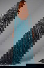 Fitted gown featuring vertical sequin lines and elegant drape