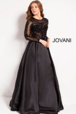 Model wearing Jovani 46066 black gown showing back detail and sheer sleeves