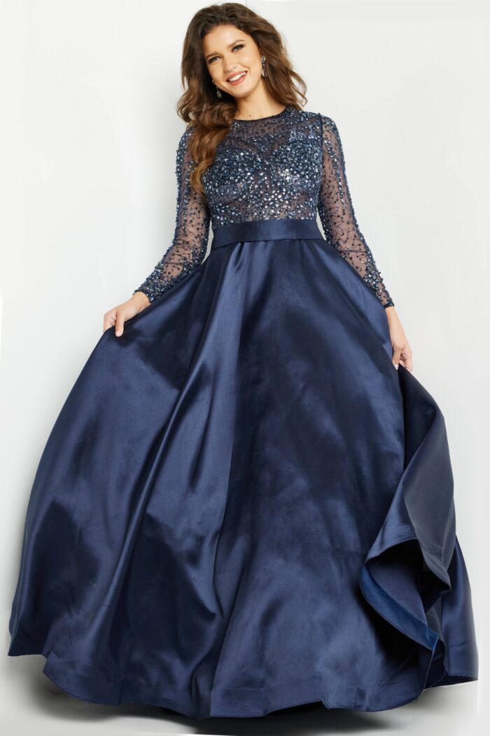 Model showcasing Jovani 46066 navy ball gown with sequined top and long sleeves