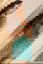 Side and back view of short teal dress with shimmering sequins