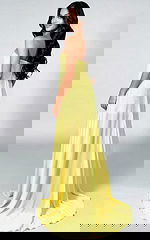 Fitted gown with bold sparkle details and dramatic cape