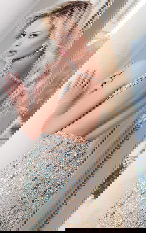 Back view of glittering bodycon dress with low cut design