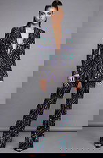 Beaded statement suit with deep V jacket and wide leg embellished pants