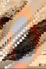 Woman Wearing High Neck Sequin Mini Dress With Sleek Design