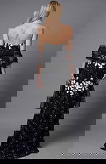 Back view of a strapless floral brocade column gown with fitted silhouette