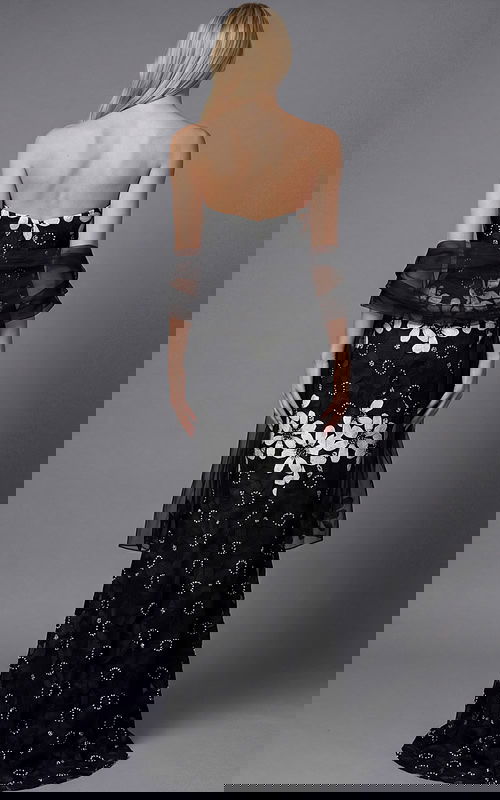 Back view of a strapless floral brocade column gown with fitted silhouette